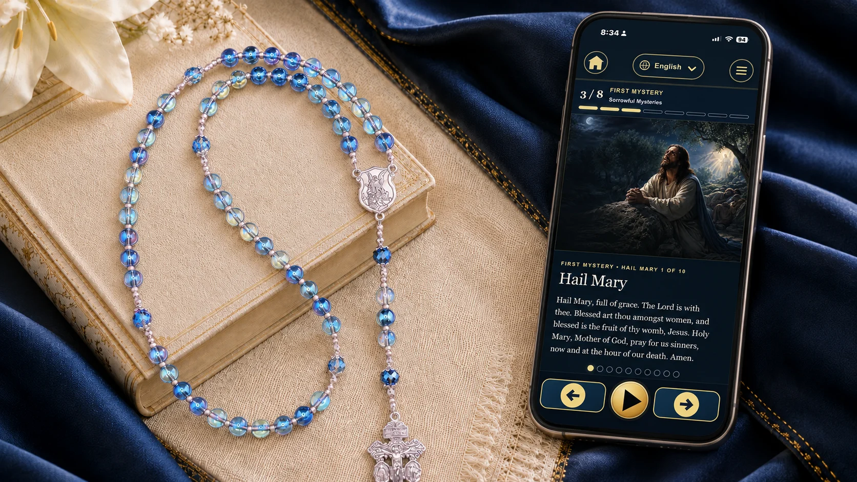 Blue handmade rosary beside the True Image Co. Living Prayer guided Rosary experience